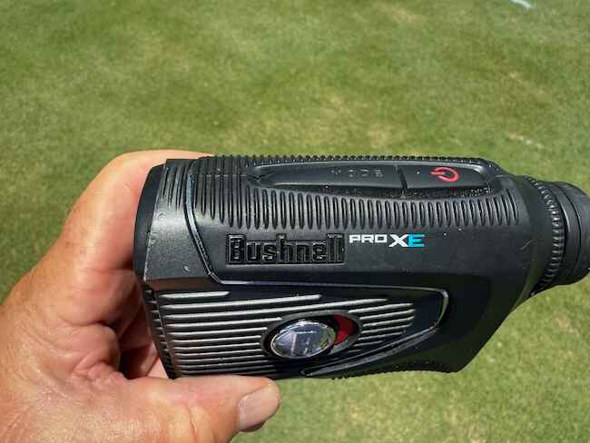 Close-up Image Of The Author Holding The Bushnell Pro XE Laser Rangefinder Close-up Image Of The Author Holding The Bushnell Pro XE Laser Rangefinder