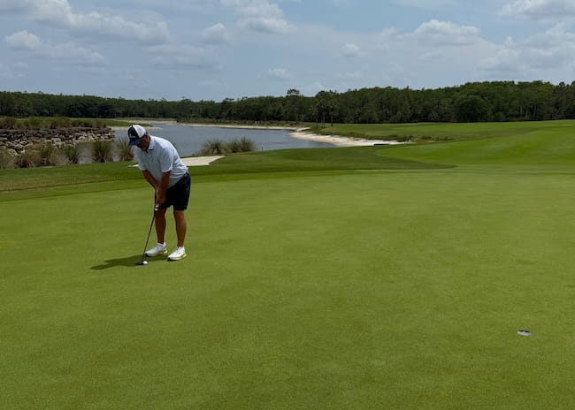 Golfer Putting On A Beautiful Green Golfer Putting On A Beautiful Green
