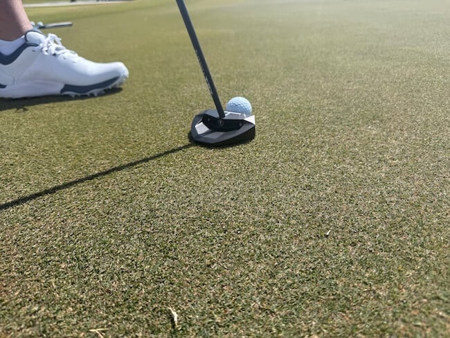 LAB Oz Putter Addressing The Golf Ball On The Putting Green LAB Oz Putter Addressing The Golf Ball On The Putting Green