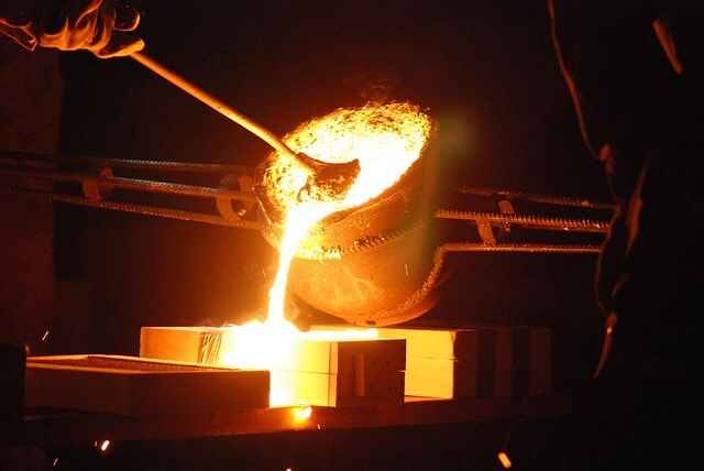 Pouring Molten Metal Into A Golf Iron Mold Pouring Molten Metal Into A Golf Iron Mold