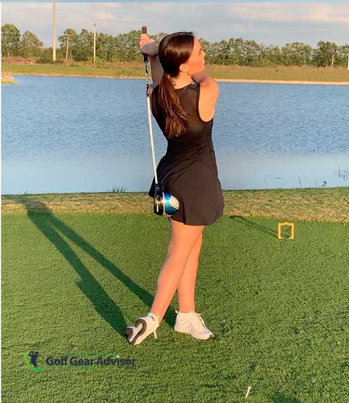 Woman Hitting Driver Off The Tee Woman Hitting Driver Off The Tee